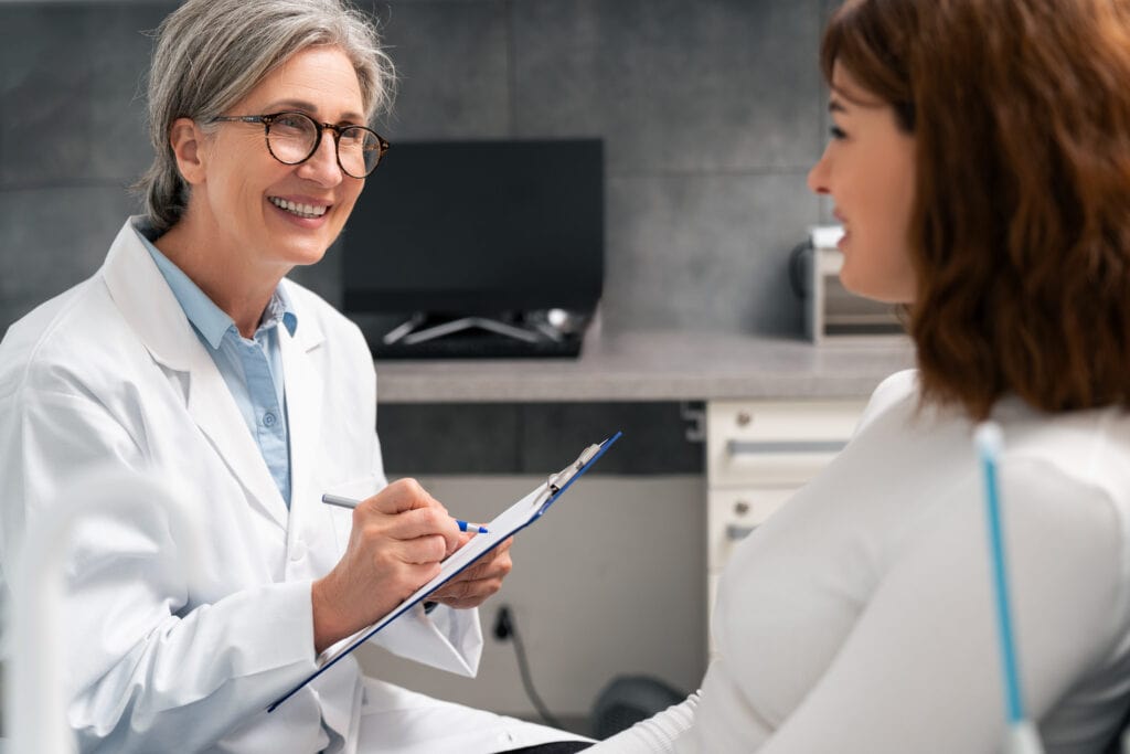 Consultation is taking place in the dentist's office.